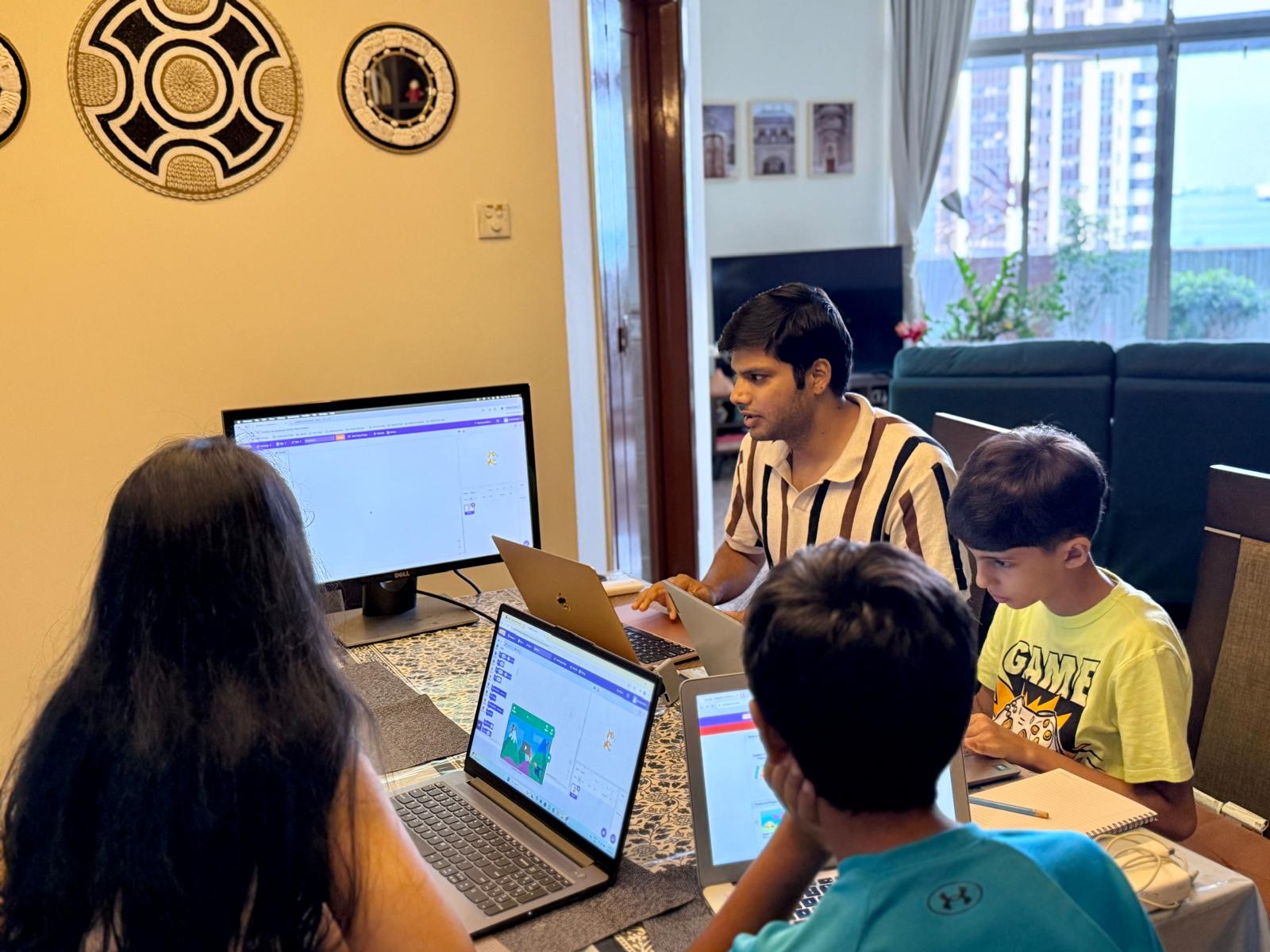 Kids working on their Scratch projects